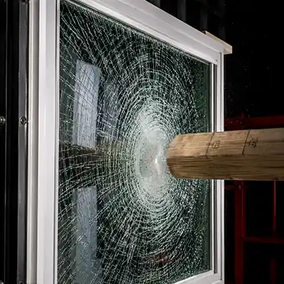 Impact-resistant glass cracked but intact after impact test, demonstrating commercial-grade performance